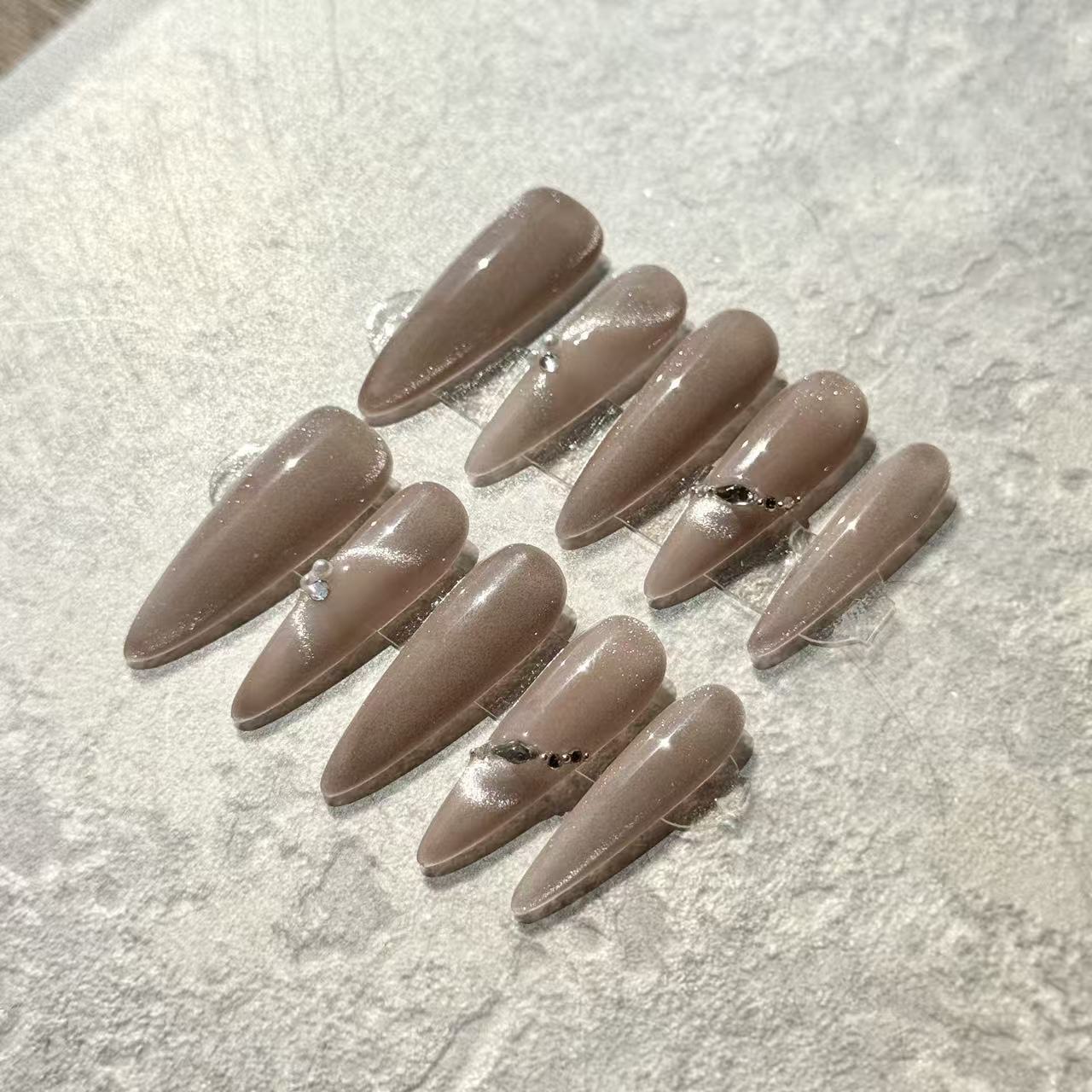 Pearl Nude Elegance – Stiletto Press-On Nails with Nude Cat-Eye Shine & Minimalist Gem Accents