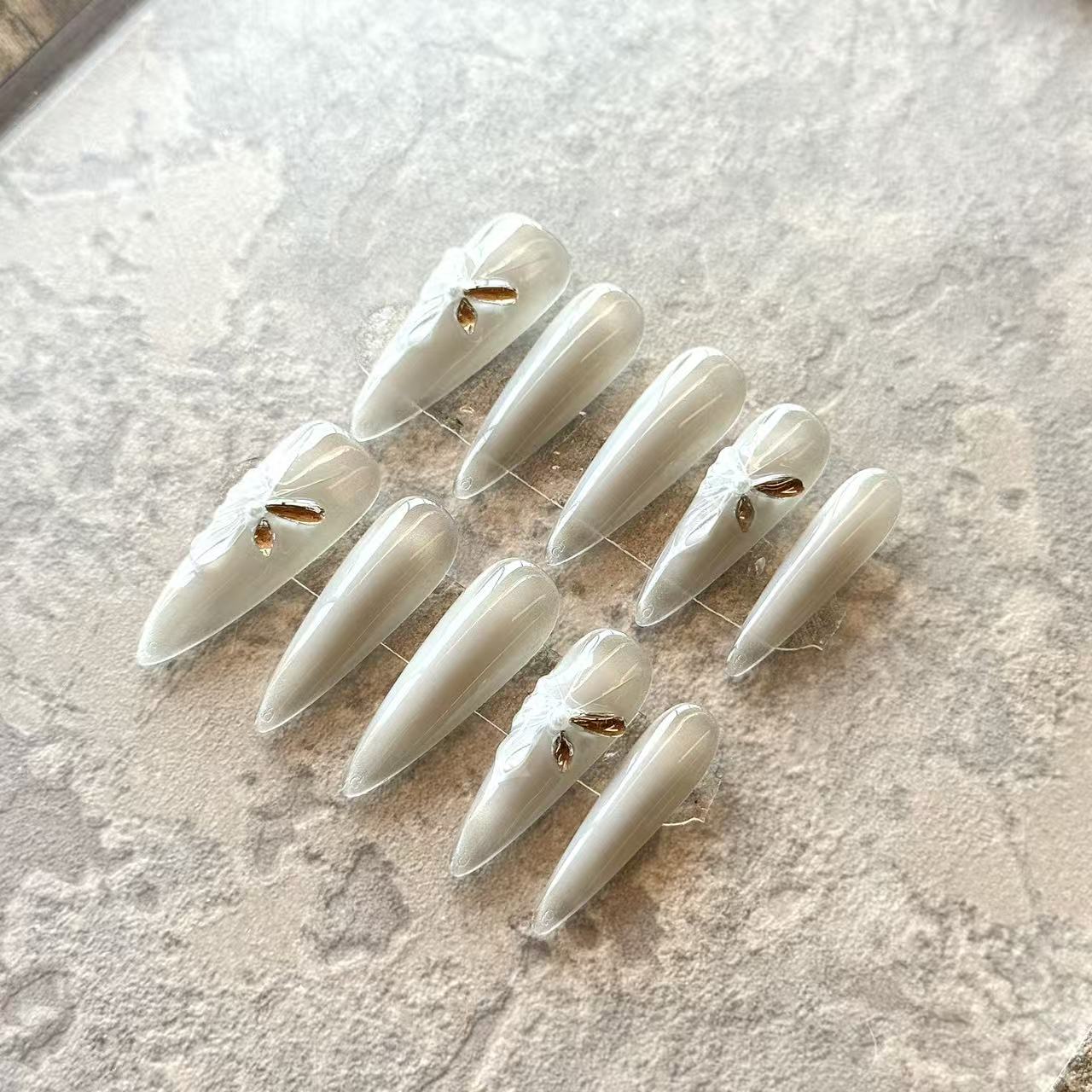 Ivory Lueur – Pearl Ombre Luxury Press-On Nails with 3D Bow & Golden Crystal Accent