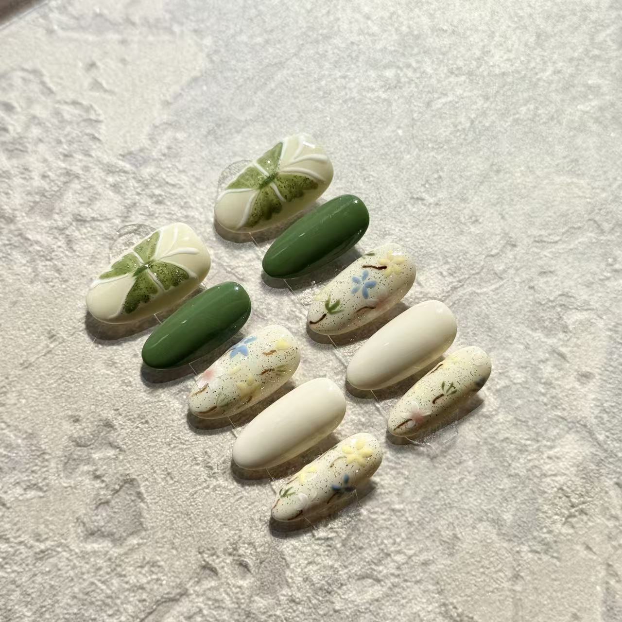 Spring Garden – Oval Press-On Nails with Green Clover, Floral Hand-Paint & Pastel Accents