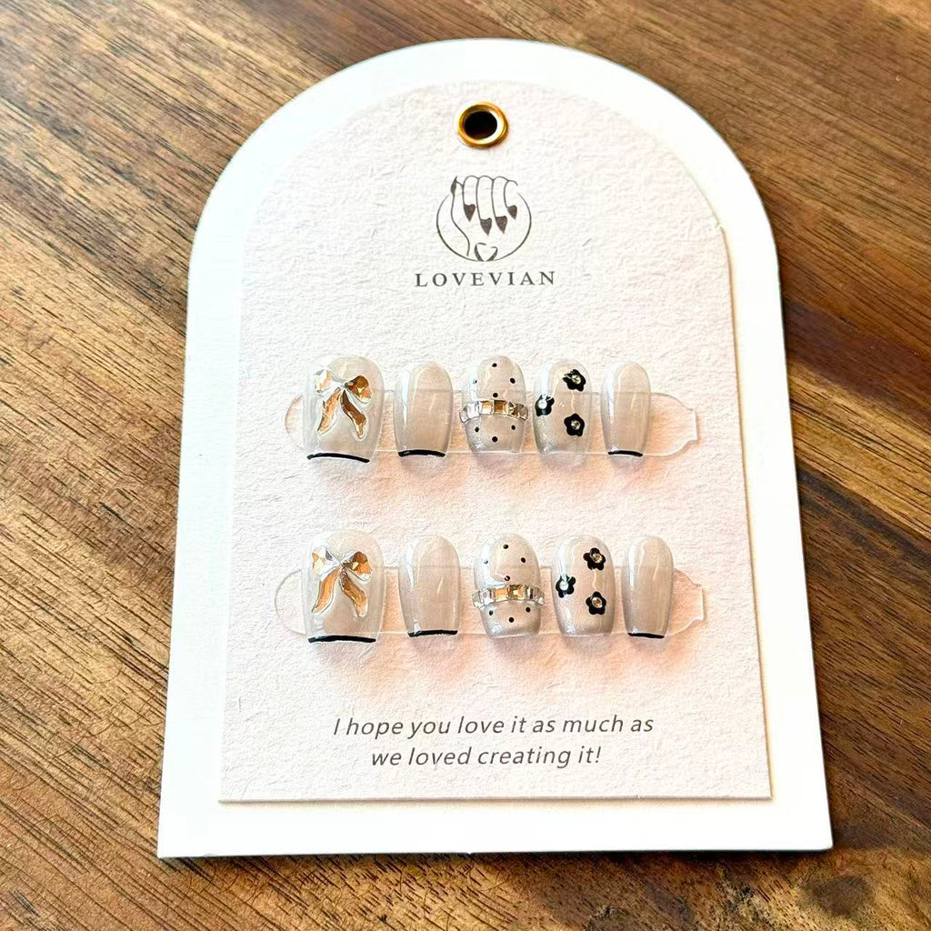 Noir Bow – Grey Sheer Luxury Press-On Nails with 3D Gold Ribbon & Floral Accents – Short Squoval Shape