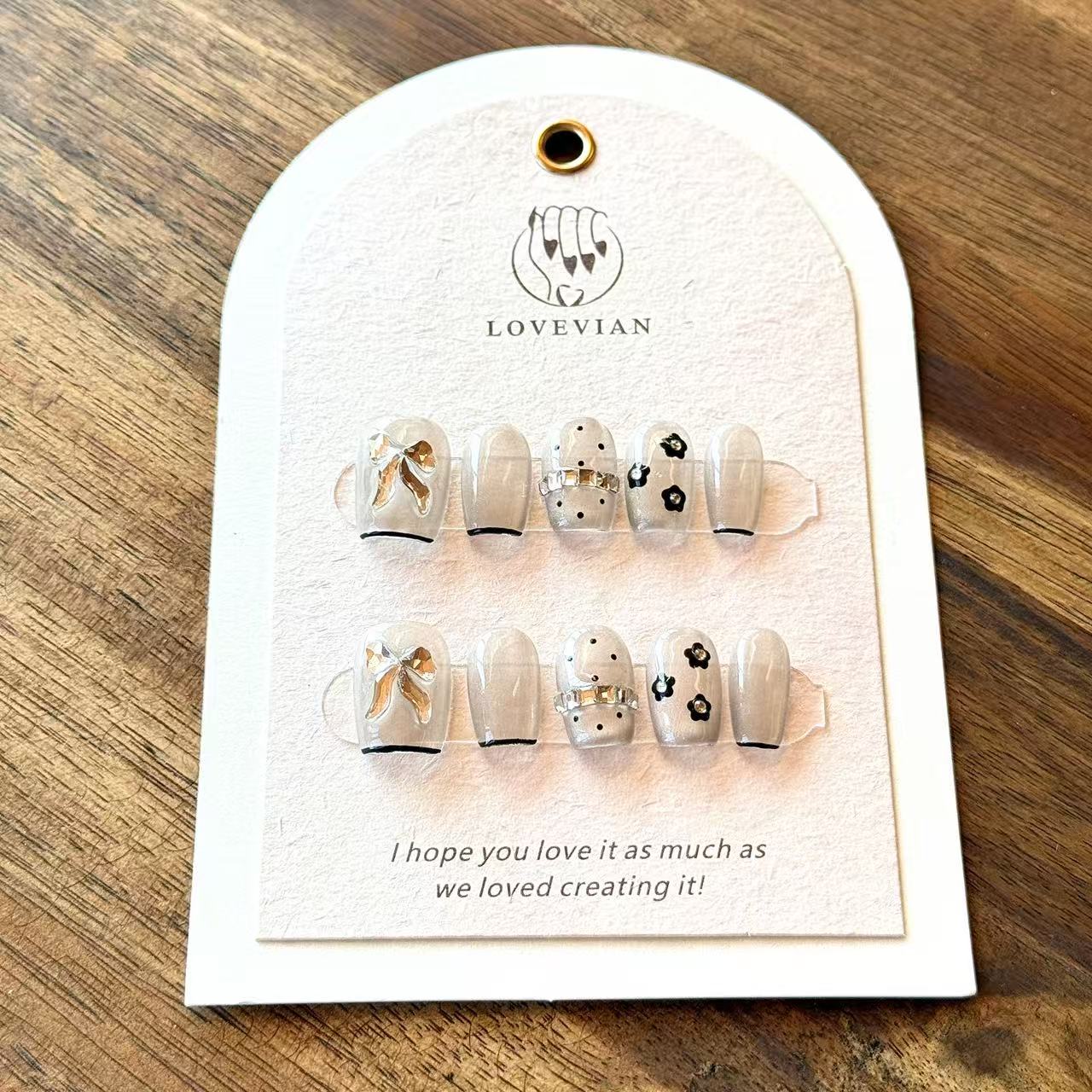 Noir Bow – Grey Sheer Luxury Press-On Nails with 3D Gold Ribbon & Floral Accents – Short Squoval Shape