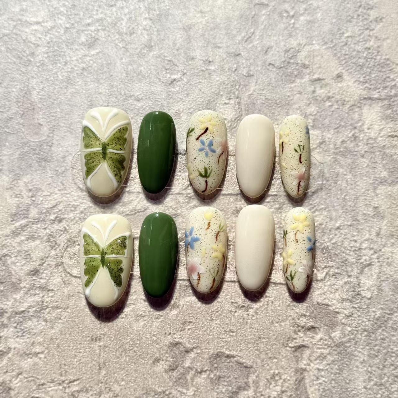 Spring Garden – Oval Press-On Nails with Green Clover, Floral Hand-Paint & Pastel Accents