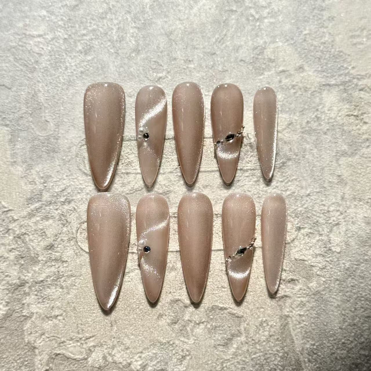 Pearl Nude Elegance – Stiletto Press-On Nails with Nude Cat-Eye Shine & Minimalist Gem Accents